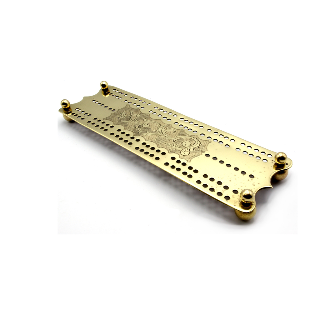 Engraved brass cribbage board