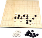 Go game board with black and white stones 