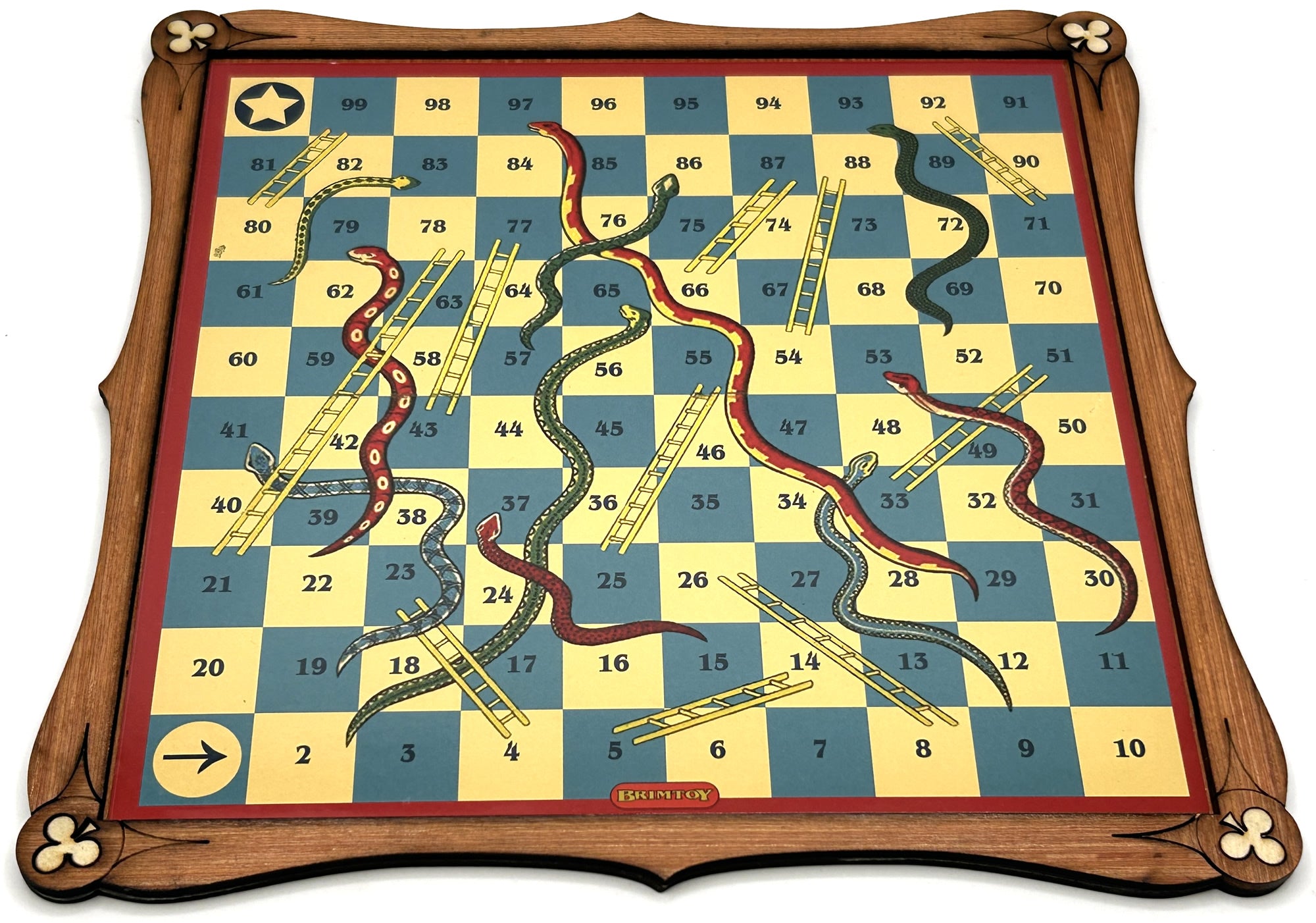 Wooden snakes and ladders board game .