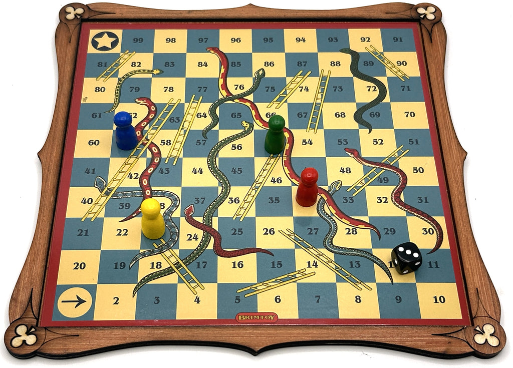 Wooden snakes and ladders board game with game pieces and die.