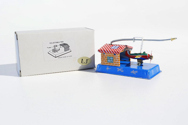 Aeroplane hangar tin toy with packaging
