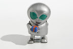 Metallic alien tin toy holding a small gift box