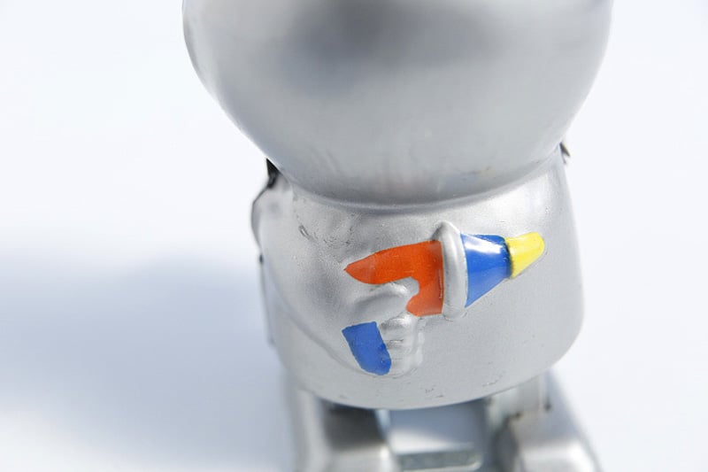 Close up of Metallic alien tin toy 