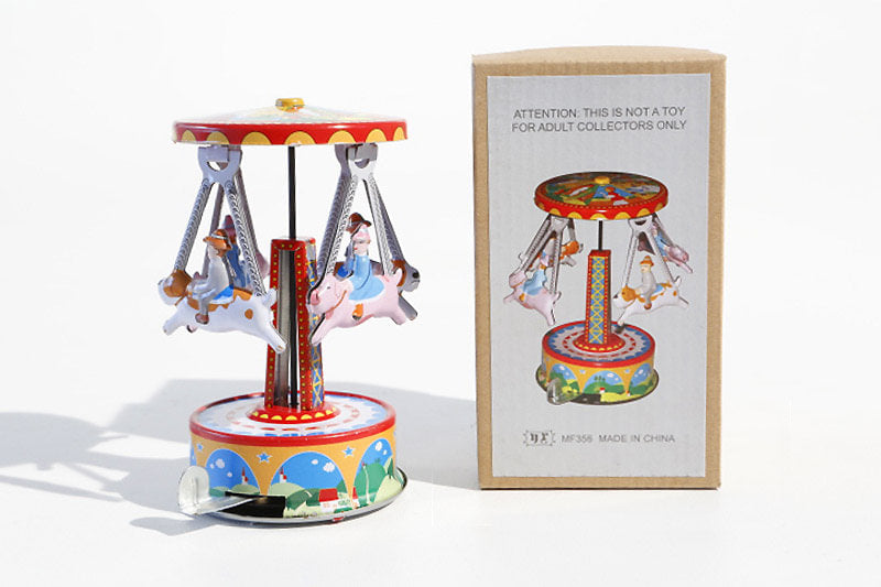 Colourful animal carousel tin toy with packaging