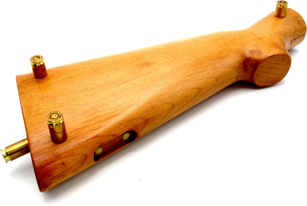 Rifle-butt cribbage board.