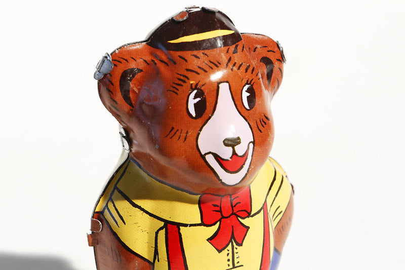 Close up of bear tin toy