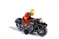 Black Motorbike Tin Toy with rider wearing red with a yellow helmet