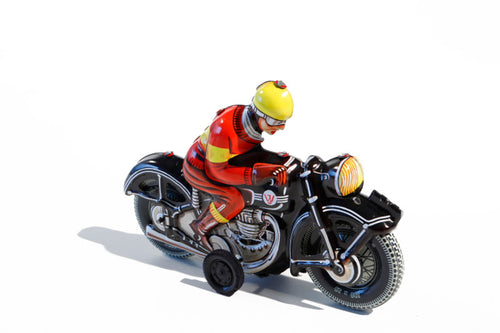 Black Motorbike Tin Toy with rider wearing red with a yellow helmet