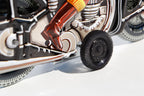 Close up of Black Motorbike Tin Toy 