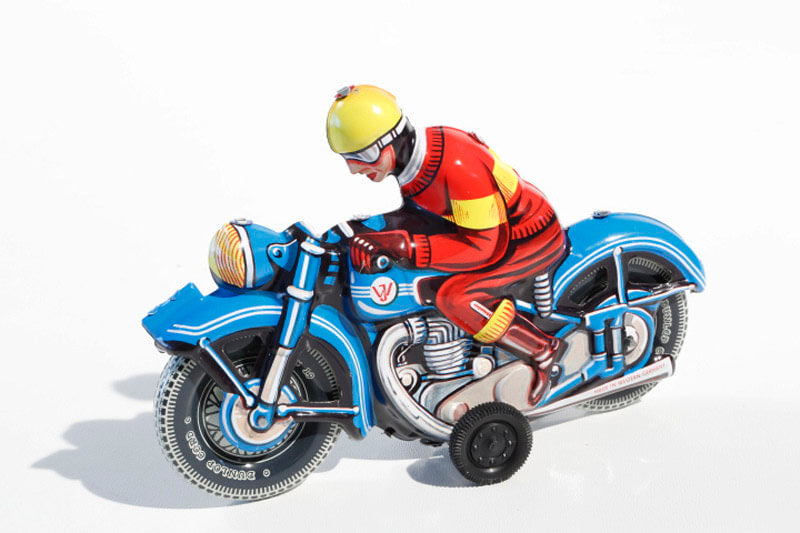 Blue Motorbike Tin Toy  - blue motorbike with person wearing red with yellow helmet. 