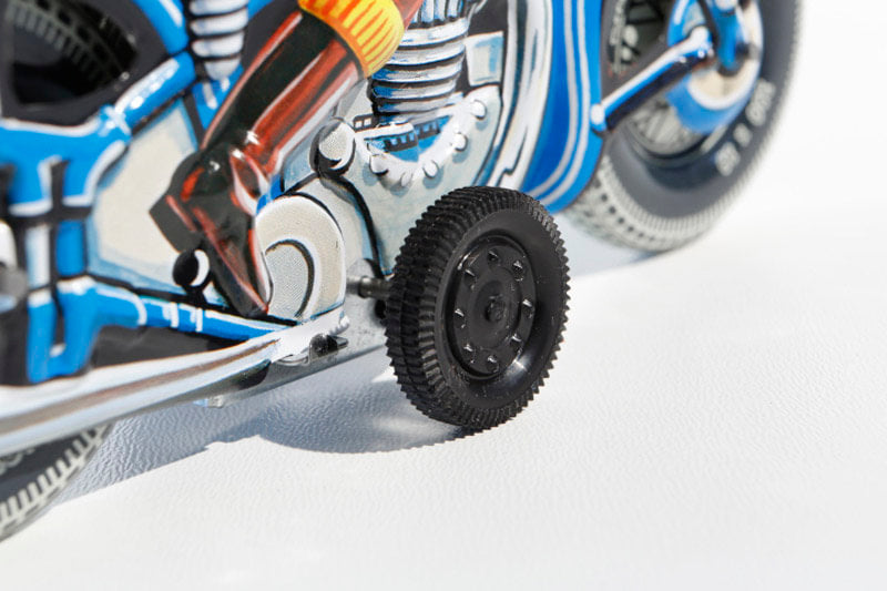 Close up of Blue Motorbike Tin Toy 