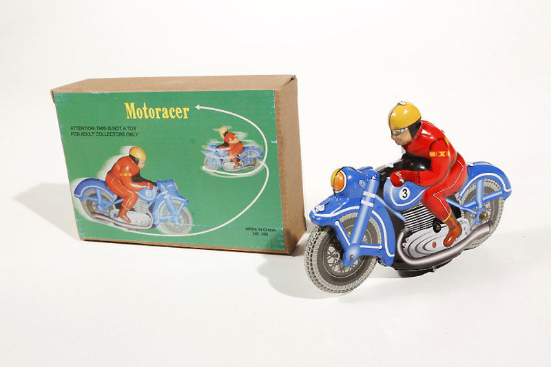 blue motor racer tin toy with green packaging 
