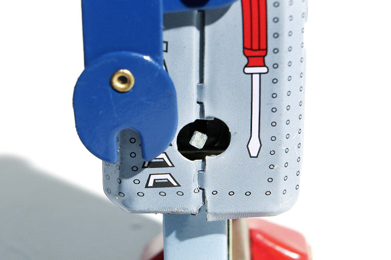 Close-up of key wind up of blue radar robot tin toy