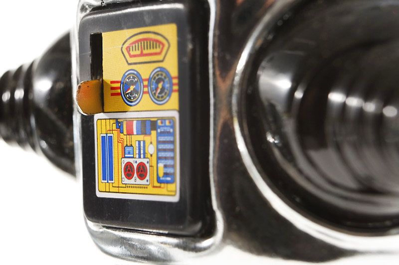 Close up of Chrome Roby robot tin toy 