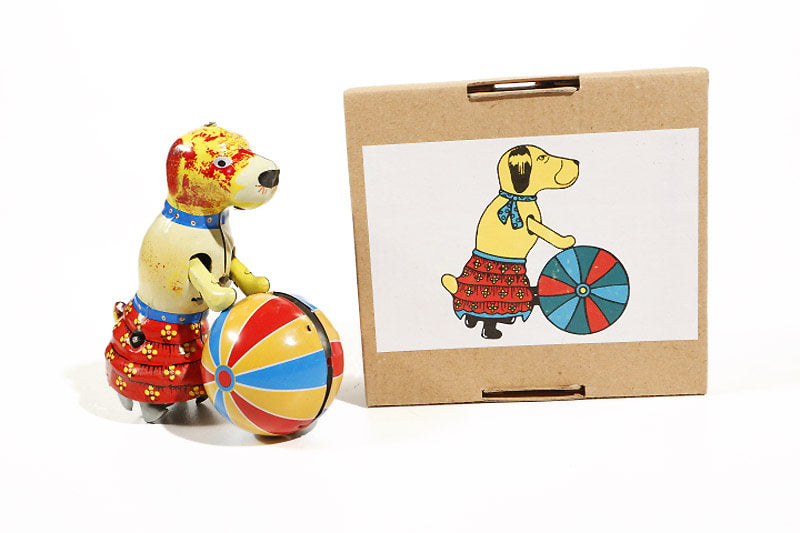 Circus Dog with ball tin toy next to its packaging