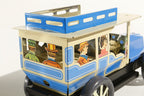 Close up of classic car tin toy with passengers 