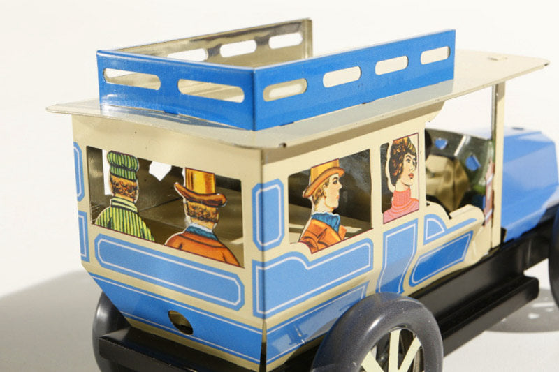 Close up of classic car tin toy with passengers 