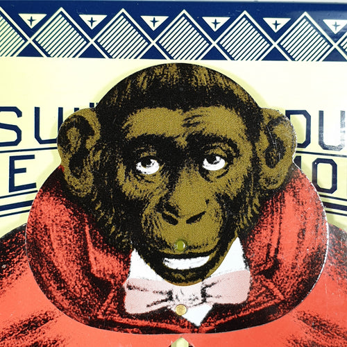 Monkey face from consult the educated monkey tin toy 