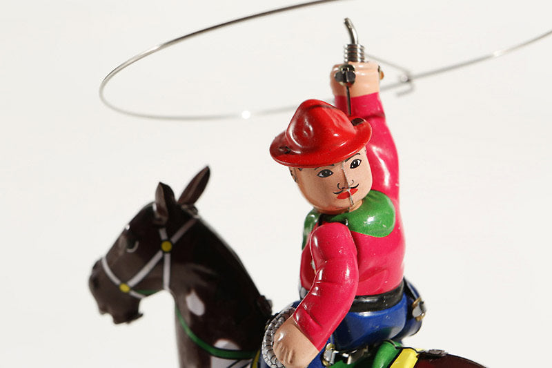 Close up of Cowboy on Horse tin toy