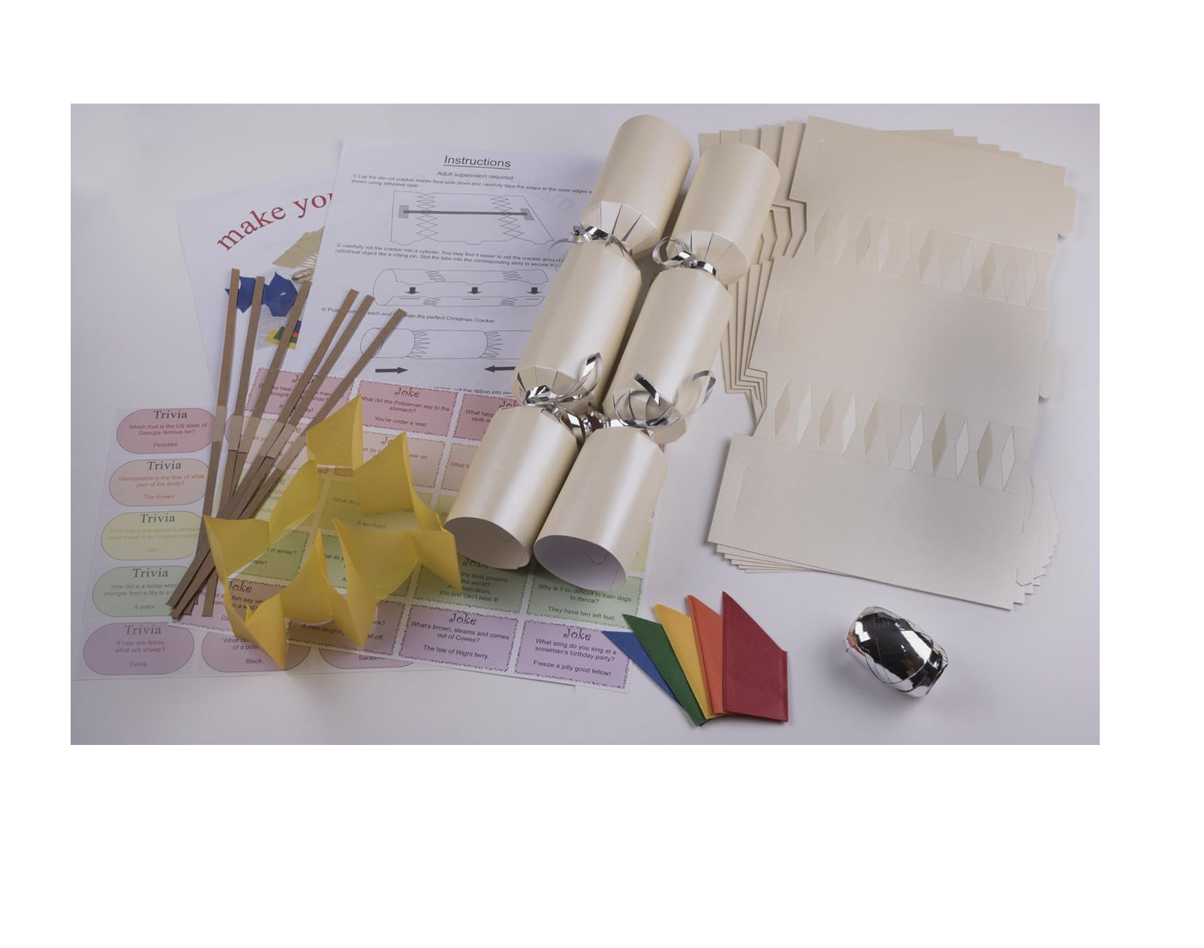 Cream make your own Christmas crackers with jokes, hats, snaps and ribbon