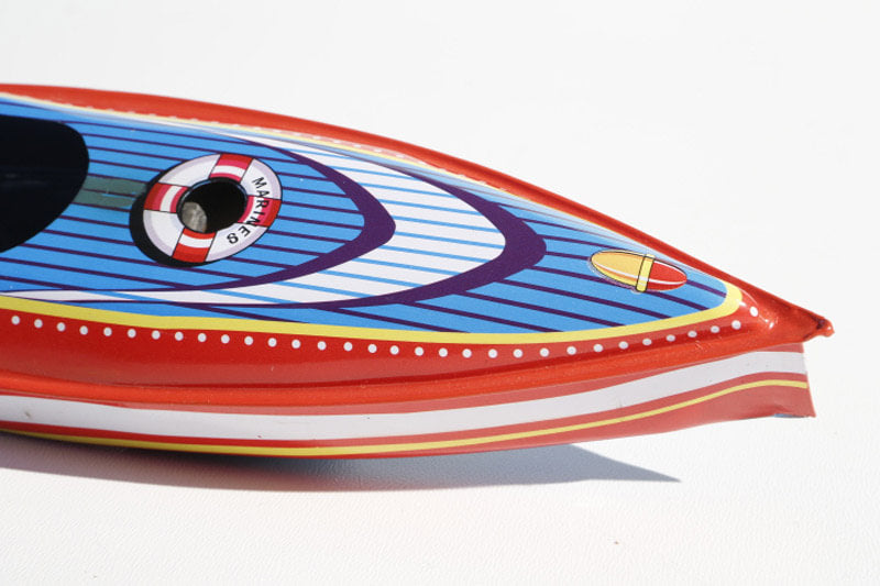 Close up of Tin Treasure's Cruiser Pop Pop Boat tin toy