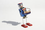 Dancing Vintage-style robot drummer tin toy with a colourful design 