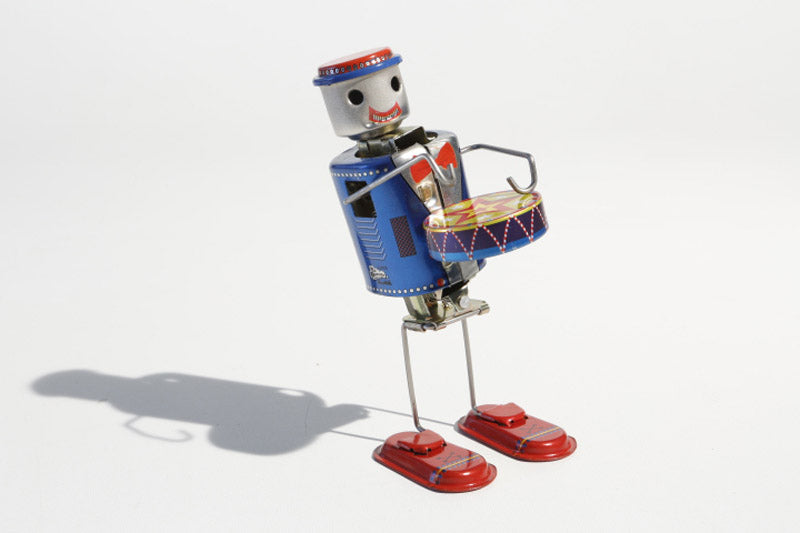 Dancing Vintage-style robot drummer tin toy with a colourful design 