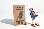 Dancing Vintage-style robot drummer tin toy with a colourful design with packaging