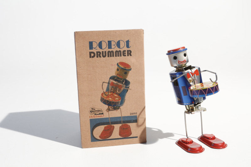 Dancing Vintage-style robot drummer tin toy with a colourful design with packaging