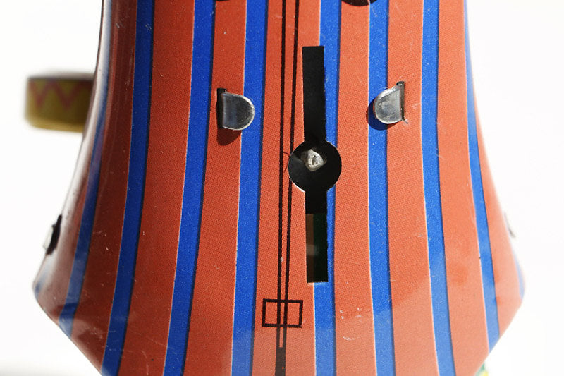 Close up of Drumming Clown tin toy