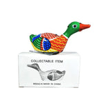 Swimming duck tin toy with its packaging