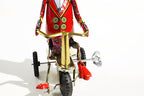Close up of Duck on Trike tin toy with wind up key