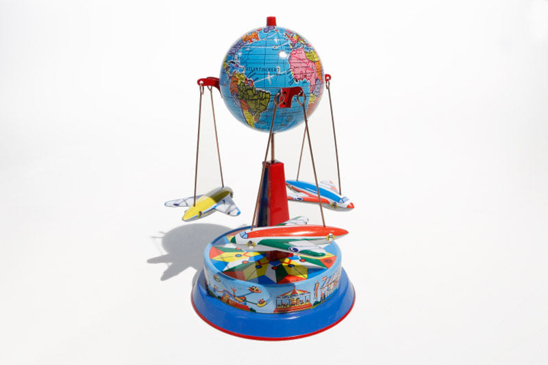 Earth Plane Carousel Tin Toy