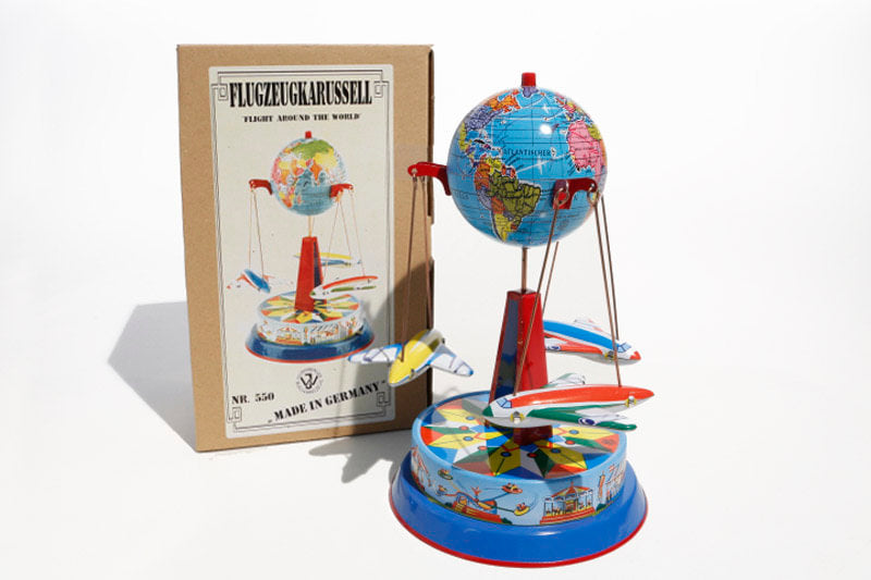 Earth Plane Carousel Tin Toy with packaging