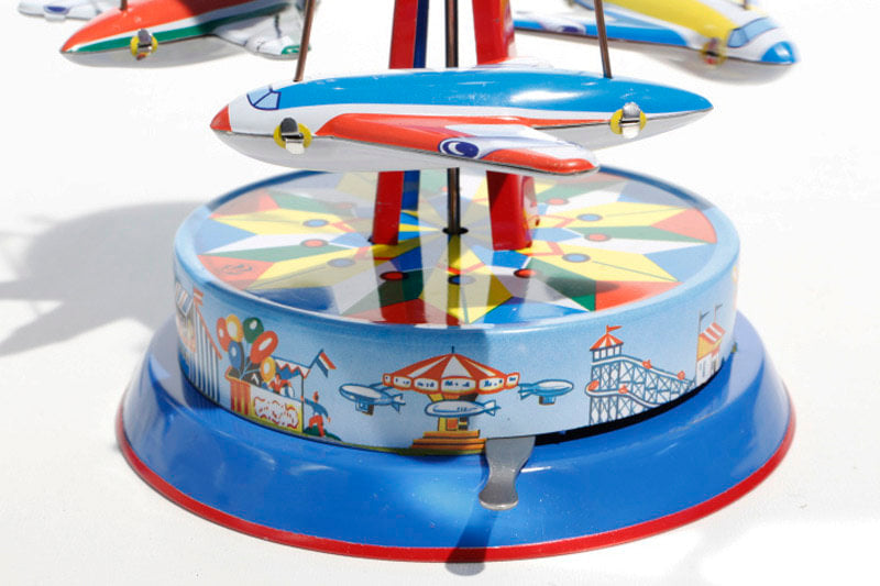 Earth Plane Carousel Tin Toy Lever