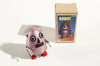 Purple Egg Man Tin Toy Robot with packaging