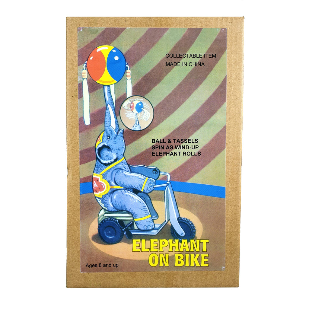 Elephant on trike tin toy packaging