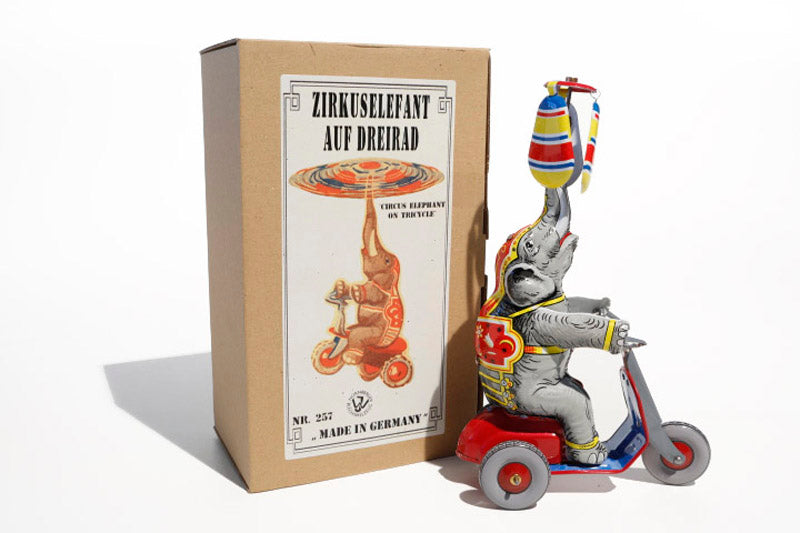 German elephant on trike tin toy with packaging