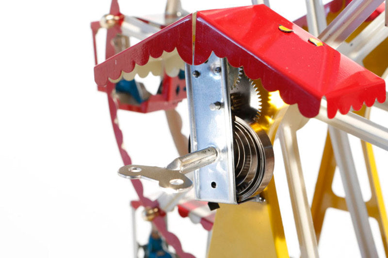 Close up of German ferris wheel tin toy key