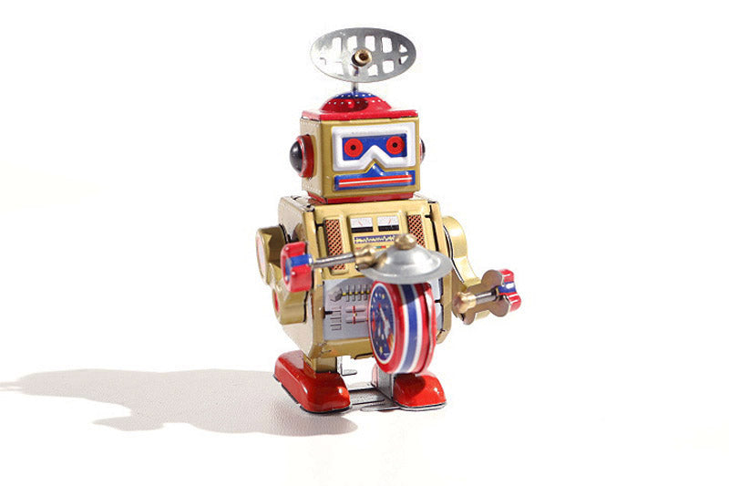 Big Gold Band Vintage-style robot tin toy with metallic gold, red, and blue colours