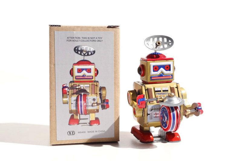 Big Gold Band Vintage-style robot tin toy with metallic gold, red, and blue colours and packaging