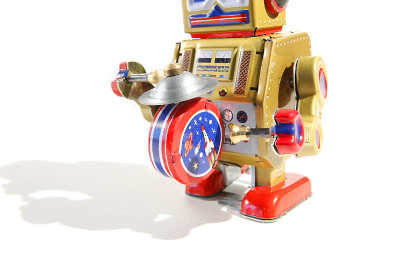 Big Gold Band Vintage-style robot tin toy with metallic gold, red, and blue colours