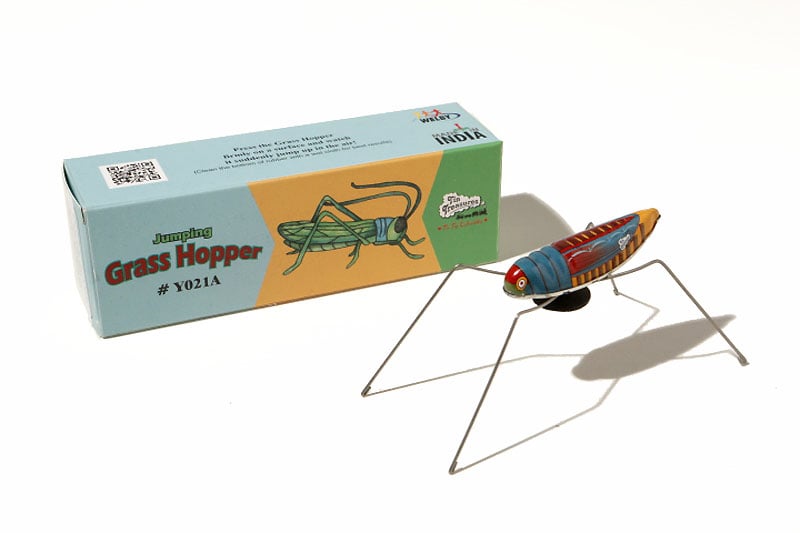 Tin Toy grasshopper with packaging 