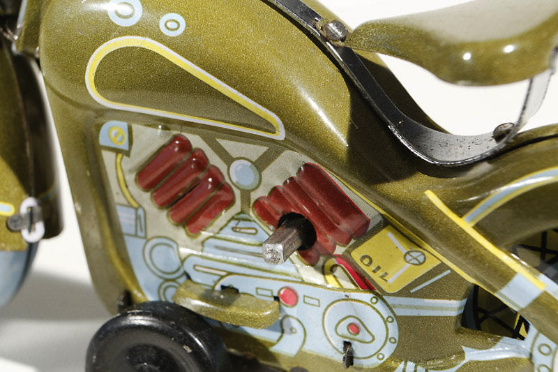 Close up of Green Harley Davidson tin toy