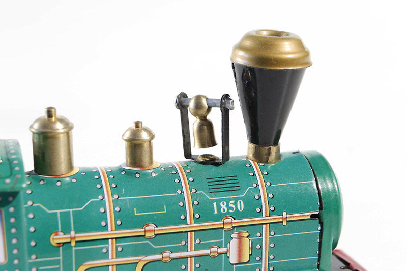 Close up of Green Wind-Up Locomotive tin toy
