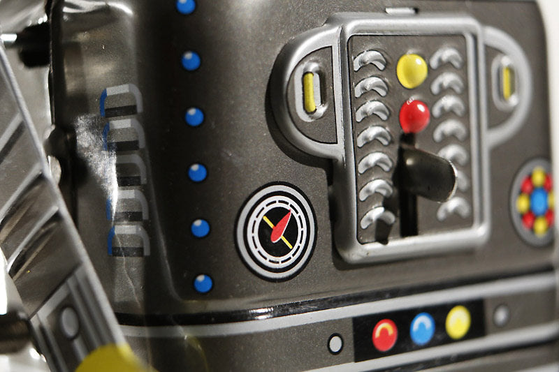 Close up of Space Man Vintage-style mechanical walking robot tin toy