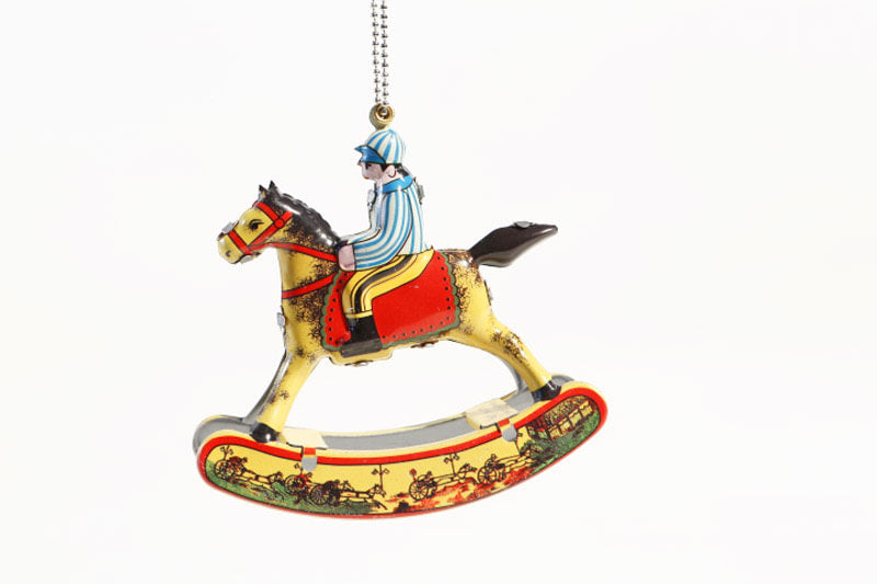 Hanging rocking horse tin toy with rider on,