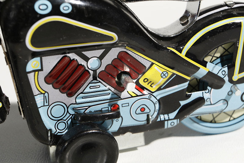Close up of black Harley Davidson tin toy