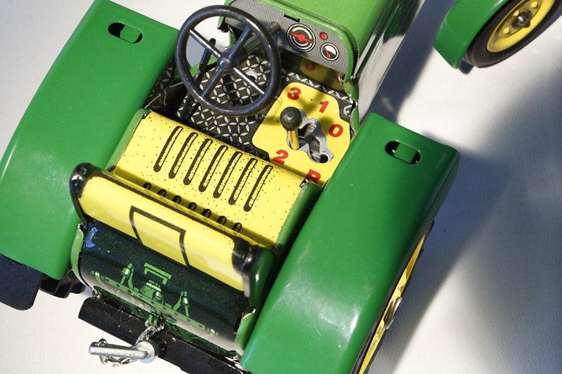 Close up of John Deere 3120 Tractor Tin Toy