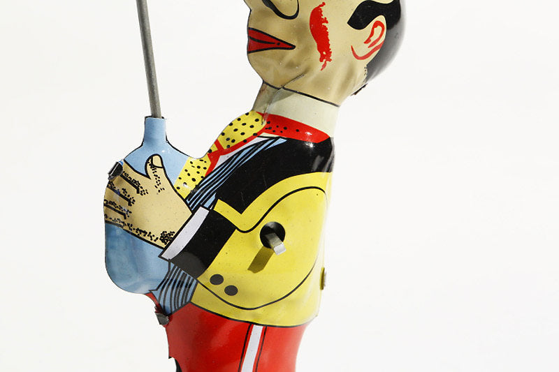 Close up of Juggler tin toy